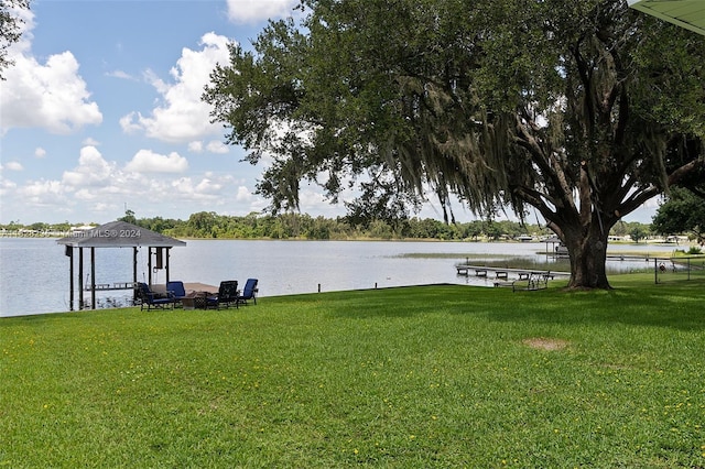 dock area featuring a yard and a water view