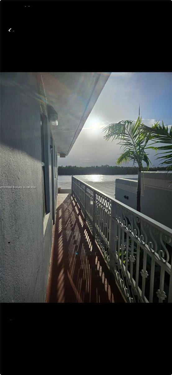 balcony featuring a water view