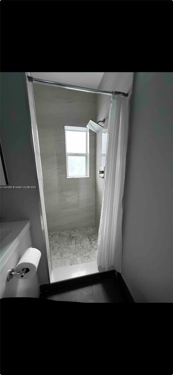 full bathroom with a stall shower