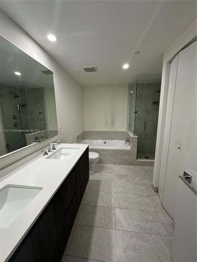 full bathroom featuring toilet, separate shower and tub, tile patterned flooring, and double vanity