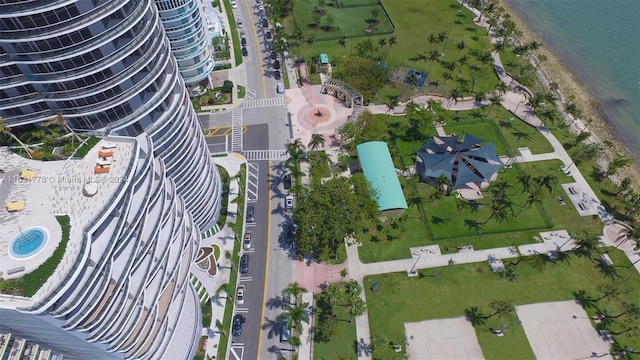 birds eye view of property with a water view