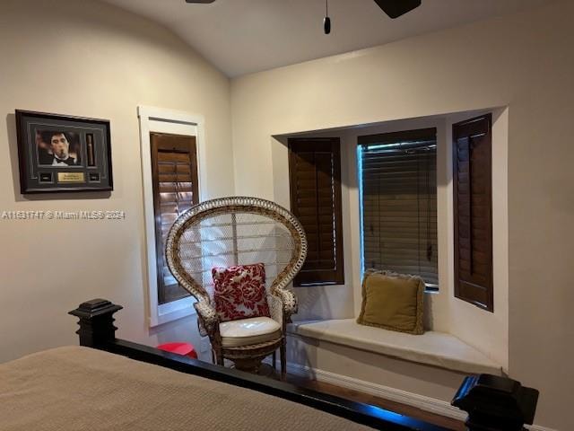 sitting room featuring ceiling fan and lofted ceiling