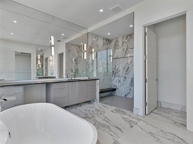 bathroom featuring independent shower and bath and vanity