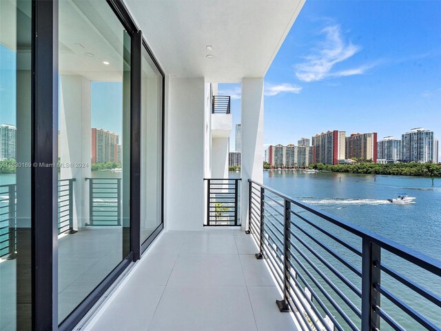 balcony featuring a water view