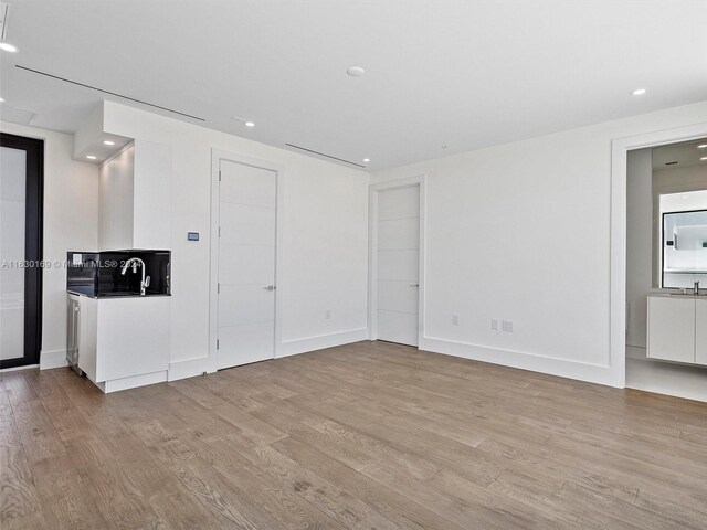 unfurnished living room with light hardwood / wood-style floors