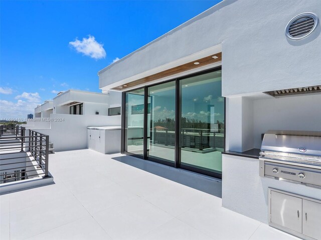 view of patio / terrace featuring exterior kitchen and grilling area