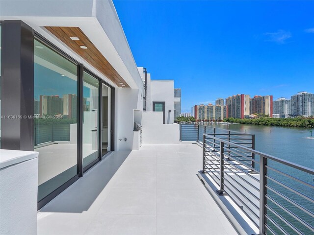 balcony featuring a water view