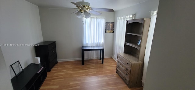 sitting room featuring light hardwood / wood-style flooring and ceiling fan