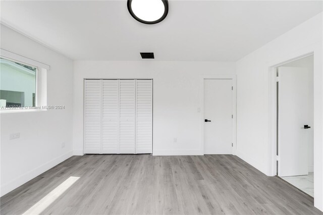 unfurnished bedroom featuring light hardwood / wood-style flooring