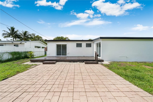 rear view of property with a deck