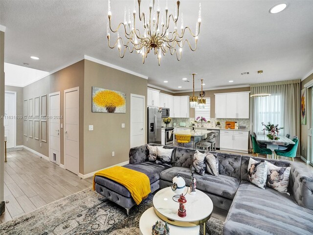 4414 Ficus St, Hollywood, FL 33021 - living room featuring recessed lighting, ornamental molding, baseboards, a chandelier, and light wood-style floors