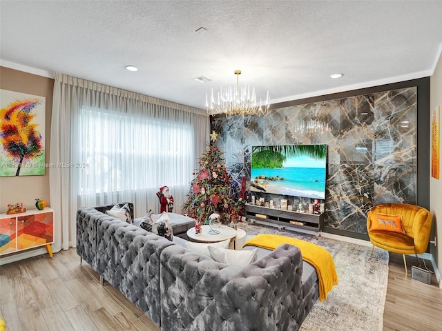4414 Ficus St, Hollywood, FL 33021 - living room with a textured ceiling, wood finished floors, and a chandelier