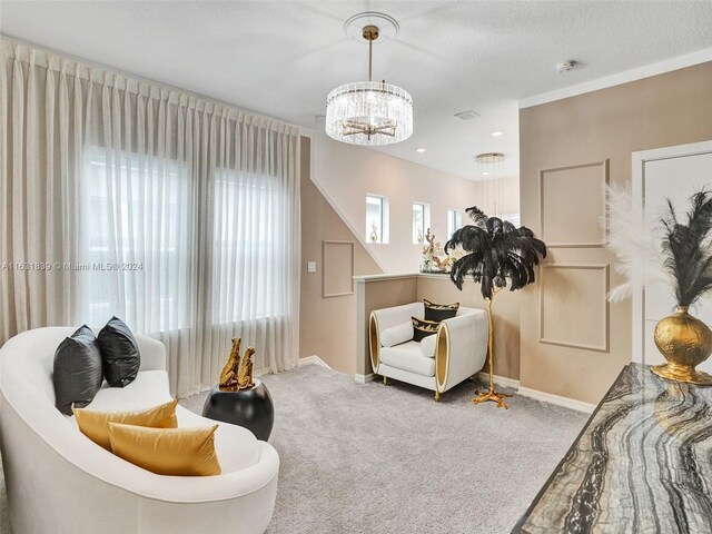 4414 Ficus St, Hollywood, FL 33021 - sitting room with a notable chandelier, carpet, baseboards, and a textured ceiling