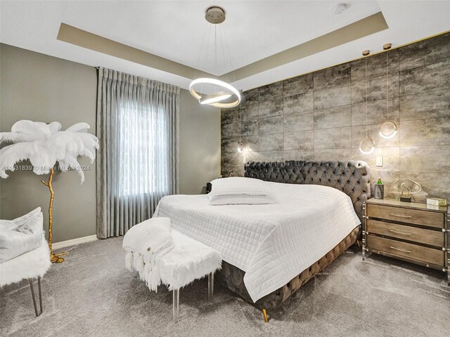 4414 Ficus St, Hollywood, FL 33021 - bedroom featuring tile walls, an inviting chandelier, carpet, and a raised ceiling
