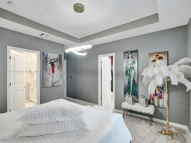 4414 Ficus St, Hollywood, FL 33021 - carpeted bedroom featuring baseboards, ensuite bath, visible vents, and an inviting chandelier