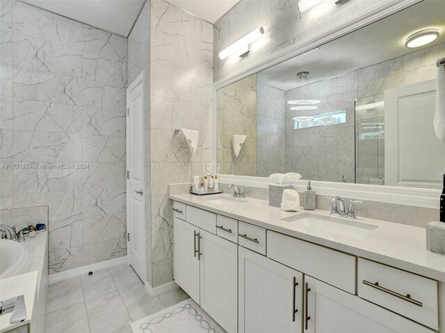 4414 Ficus St, Hollywood, FL 33021 - bathroom with tile walls, a sink, and a garden tub