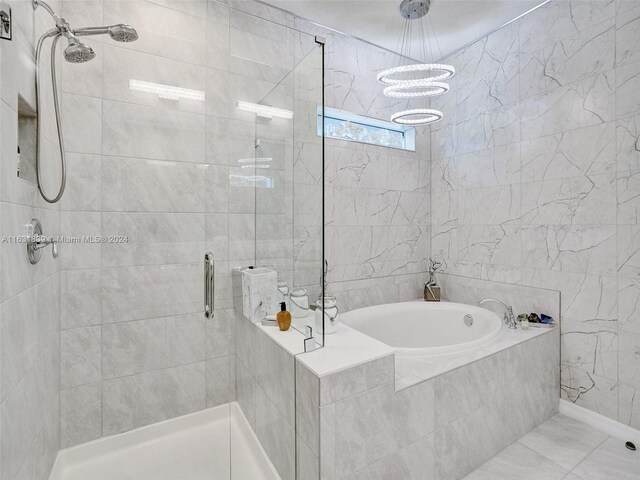 4414 Ficus St, Hollywood, FL 33021 - full bathroom with a shower stall, an inviting chandelier, and a garden tub