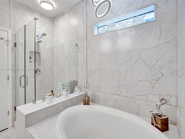 4414 Ficus St, Hollywood, FL 33021 - full bathroom with tile walls, a bathing tub, and a stall shower