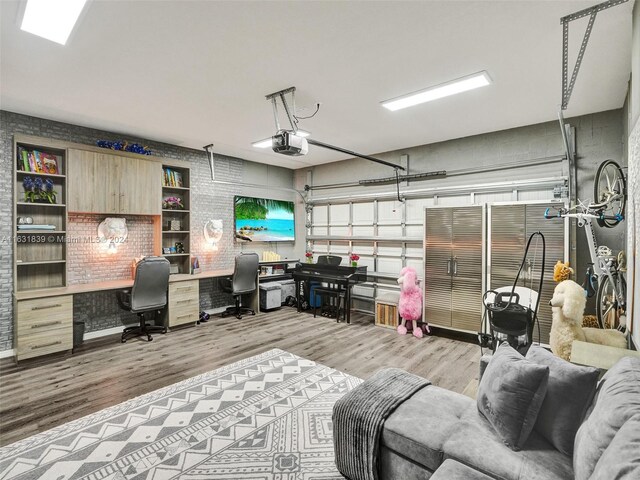 4414 Ficus St, Hollywood, FL 33021 - home office with brick wall, a garage, and wood finished floors
