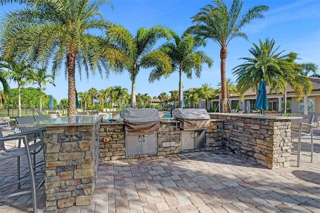 4414 Ficus St, Hollywood, FL 33021 - view of patio featuring exterior kitchen and exterior bar