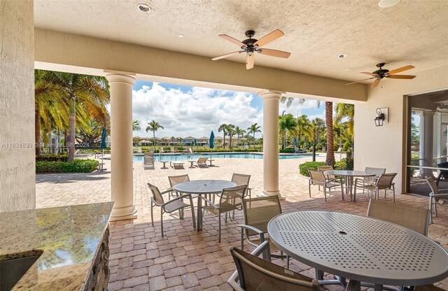 4414 Ficus St, Hollywood, FL 33021 - view of patio / terrace featuring ceiling fan, outdoor dining space, and a community pool