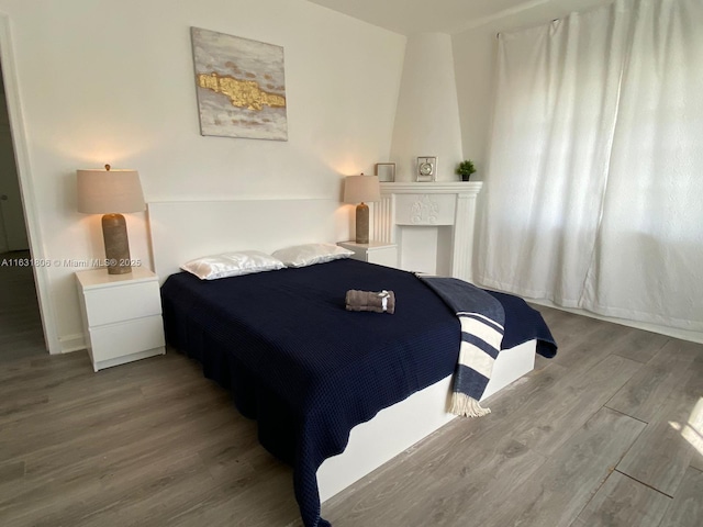 bedroom with wood-type flooring