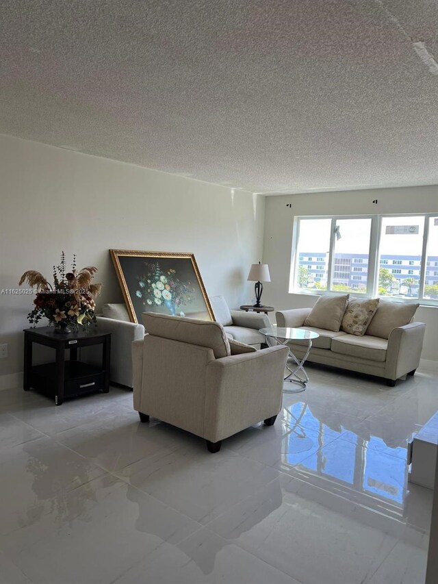 living room with a textured ceiling