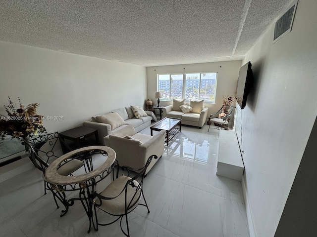 living room with a textured ceiling