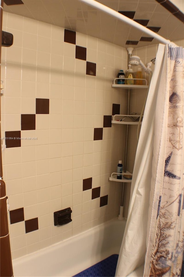 bathroom featuring shower / bath combination with curtain