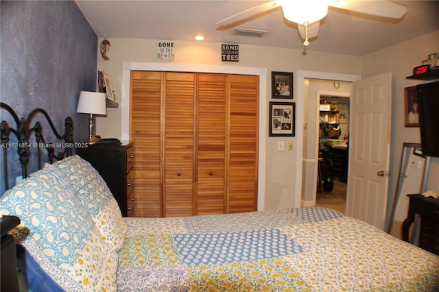 bedroom featuring ceiling fan and a closet