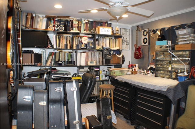 interior space featuring ceiling fan and ornamental molding