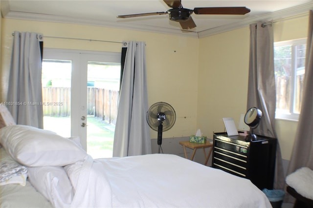 bedroom with ceiling fan, access to exterior, ornamental molding, and multiple windows