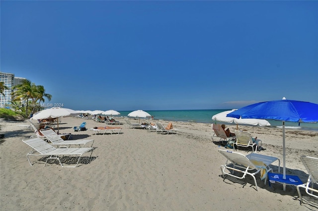 property view of water featuring a beach view