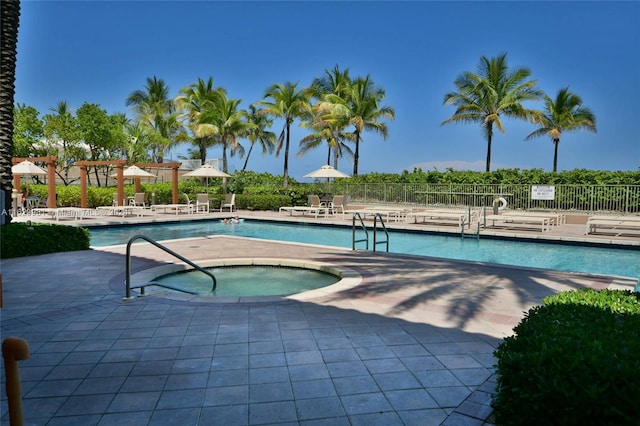 view of pool with a pergola, a patio area, and a community hot tub