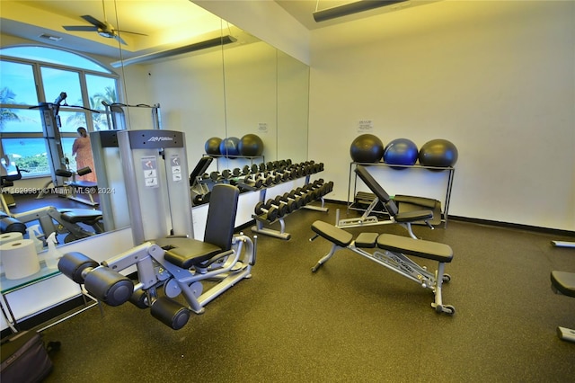 exercise room with ceiling fan