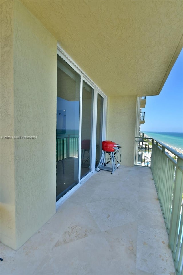 balcony featuring a water view