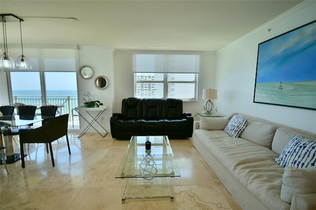 tiled living room with a water view and crown molding