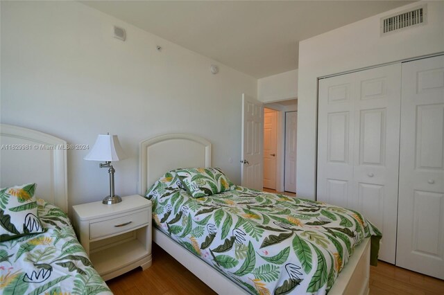 bedroom featuring a closet and hardwood / wood-style floors