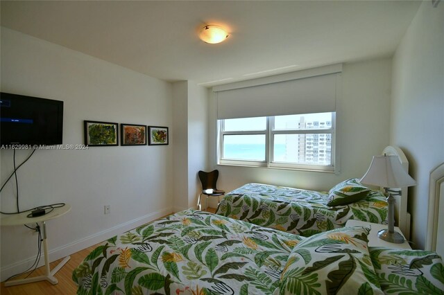 bedroom with hardwood / wood-style flooring