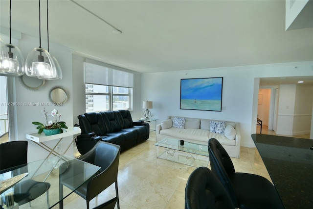 living room with a notable chandelier and light tile patterned floors