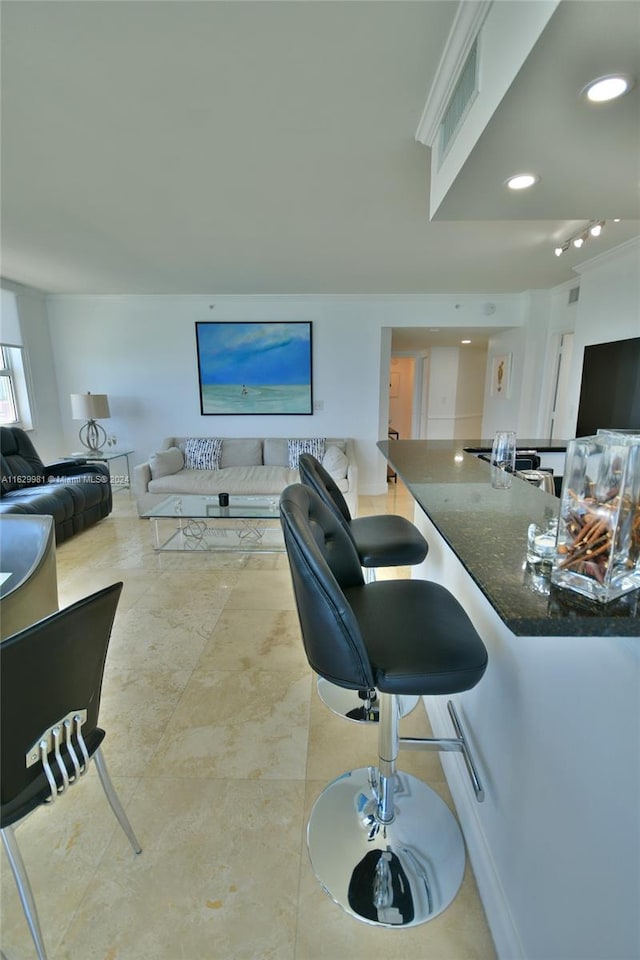 bar featuring light tile patterned flooring and dark stone counters