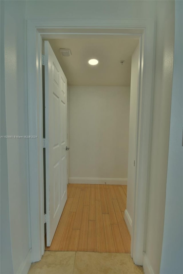 hall with light hardwood / wood-style flooring