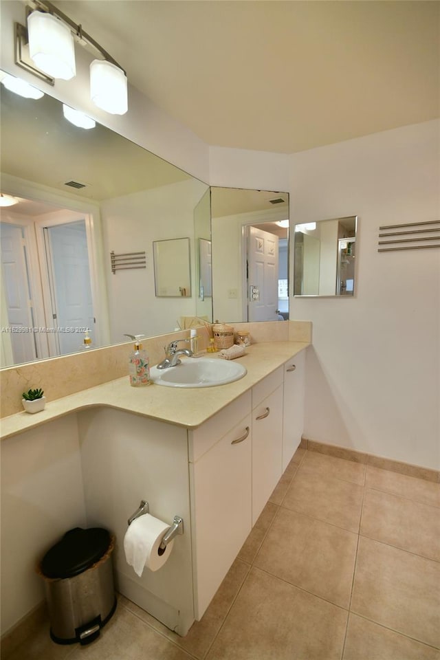 bathroom with vanity and tile patterned floors