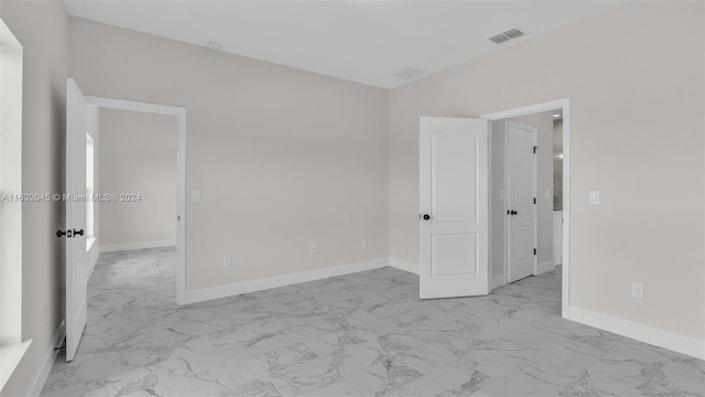 spare room with light tile patterned floors