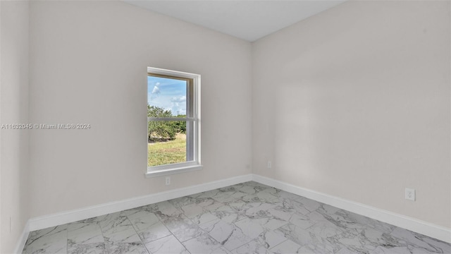 view of tiled spare room