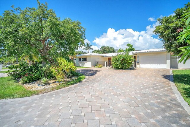 single story home featuring a garage