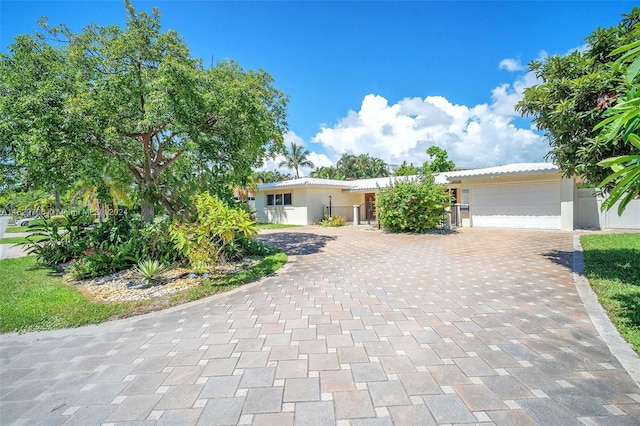 ranch-style house featuring a garage