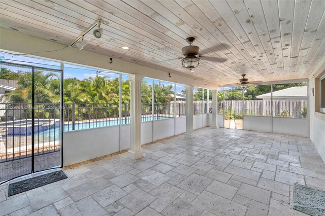 back of house with a sunroom and a yard