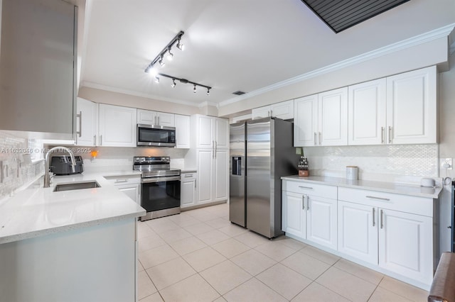 kitchen featuring ornamental molding, stainless steel appliances, a sink, and light tile patterned flooring