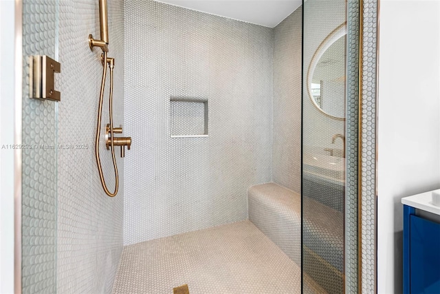 bathroom featuring vanity and walk in shower